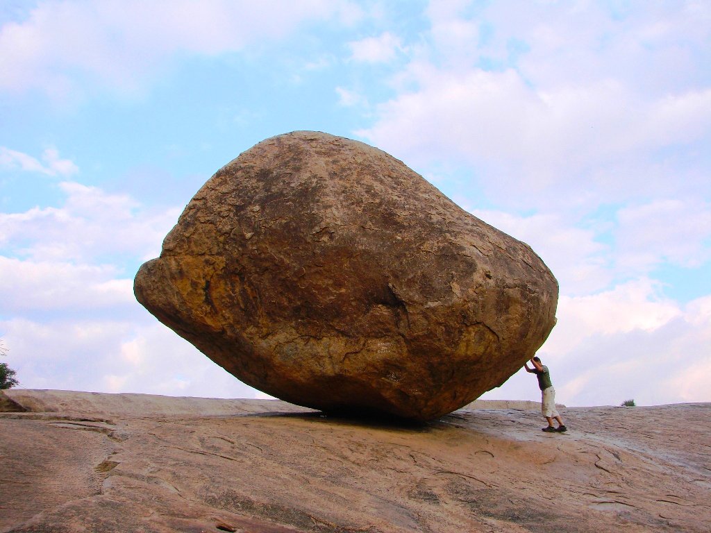 Man-trying-to-push-Krishnas-butter-ball-
